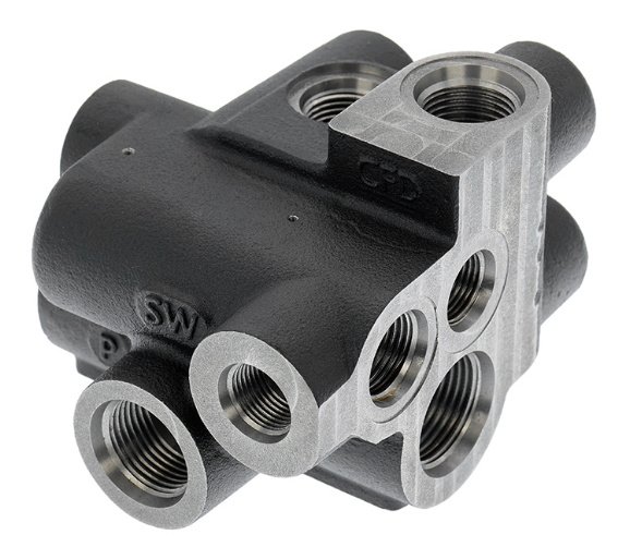 Precision CNC machined valve block with integrated ports for hydraulic and pneumatic systems