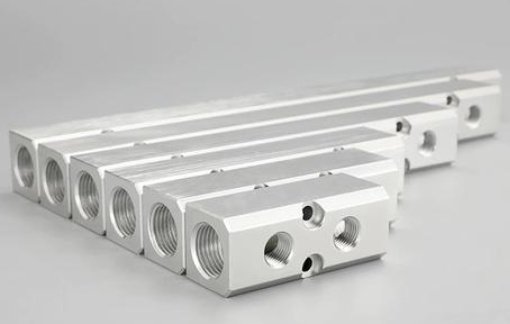 Pneumatic manifold block for low‑pressure control systems