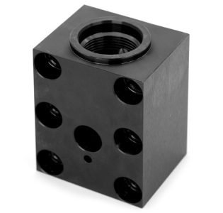 Precision machined junction block for high-tolerance, corrosion-resistant components for oil and gas applications