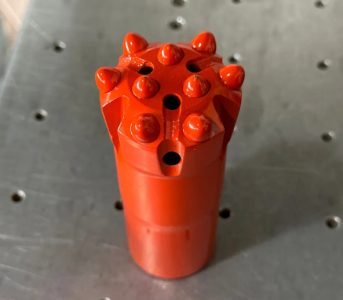 Corrosion-resistant tungsten carbide drill bit for sour gas wells